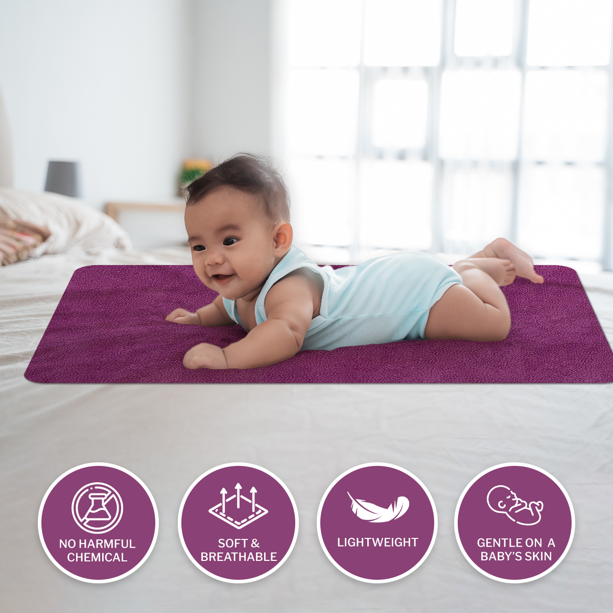 a boy laying on a bed with a teddy bear