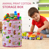 a little girl sitting at a table with a cake