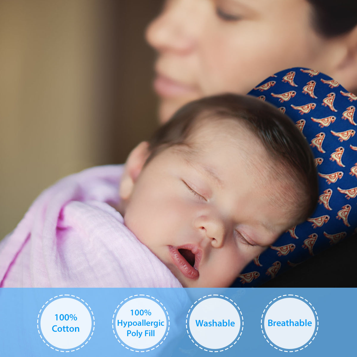 a baby laying in a bed with a blanket