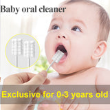 a baby with a toothbrush in his mouth