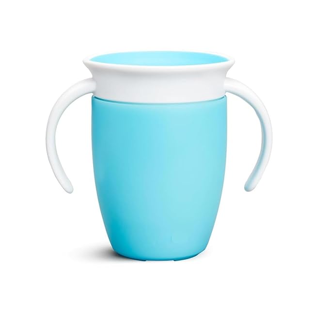 a blue vase sitting on top of a table