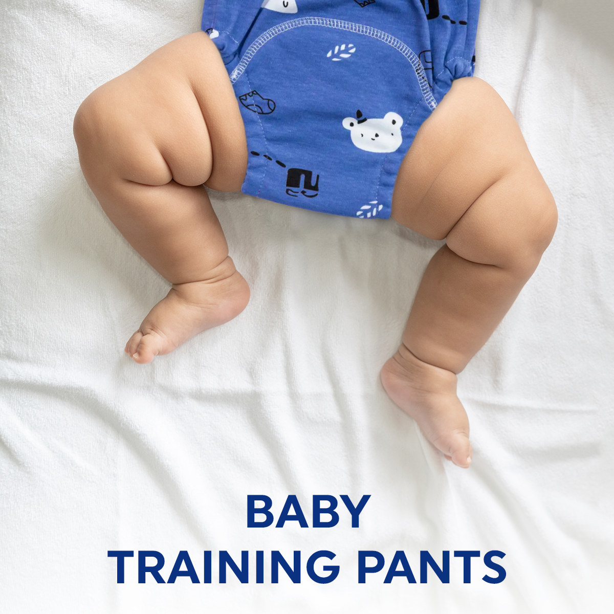 a naked baby is wearing a blue shirt 